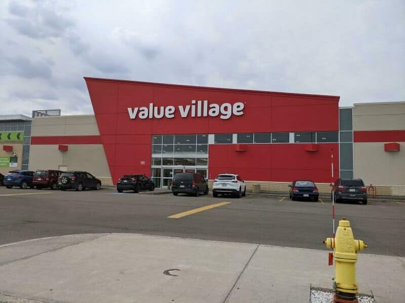 Value Village store with parking lot and yellow fire hydrant in front.