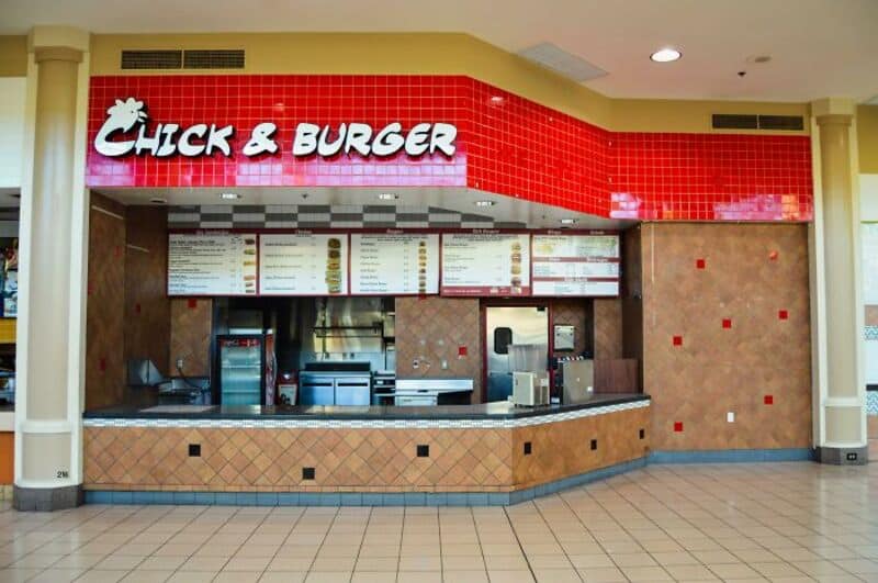Chick & Burger fast food counter with red sign and menu boards.