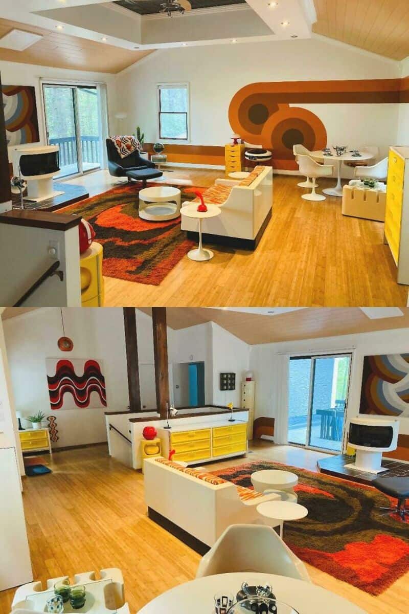 Colorful living room with modern furniture, abstract wall art, and large windows.