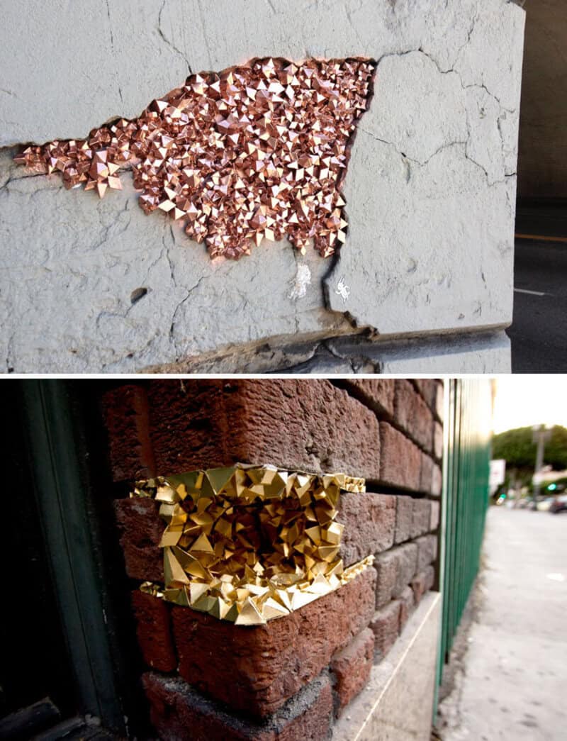 Broken wall with copper and gold foil patches for repair.