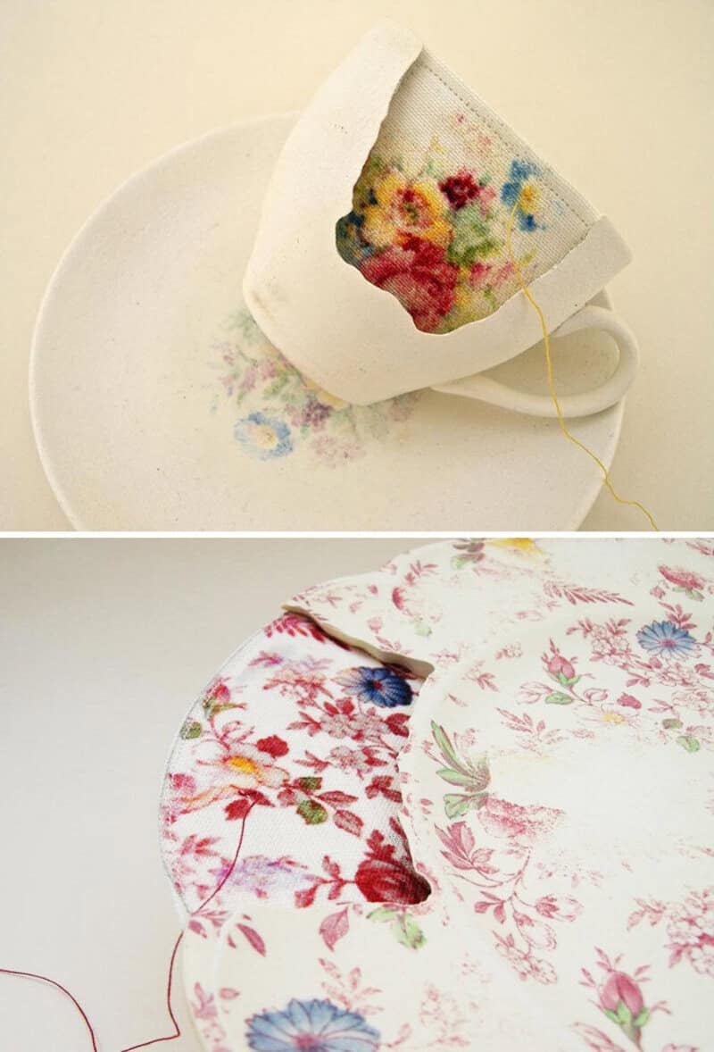 Tea cup with a floral fabric patch and matching fabric on a plate.