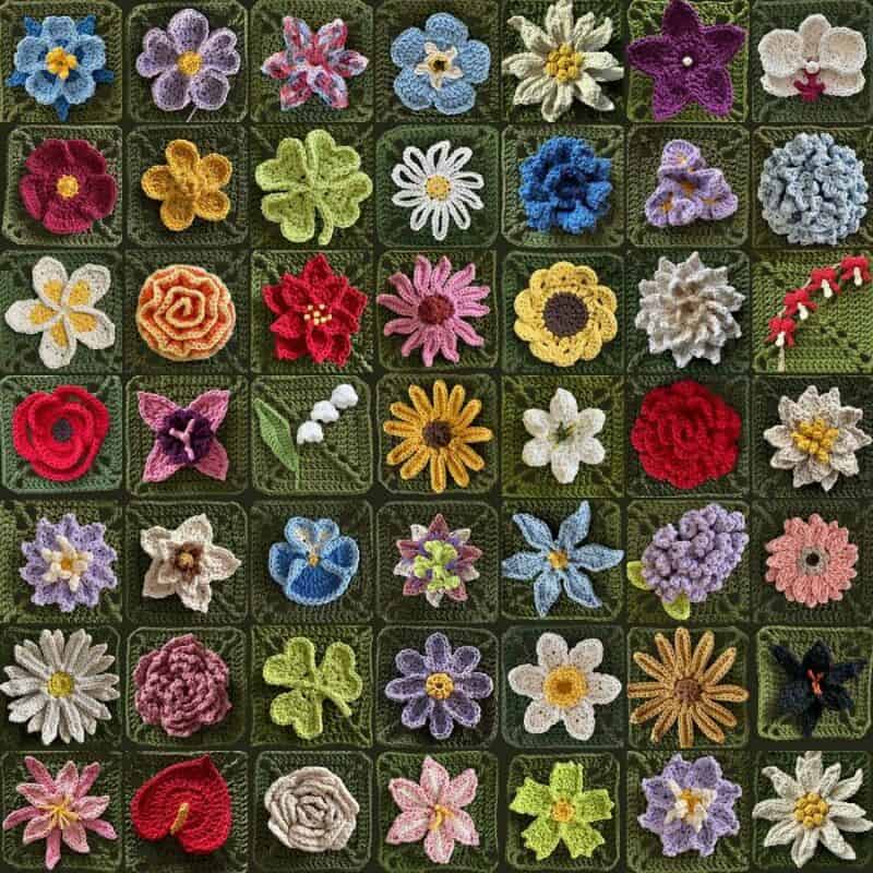 Colorful crochet flower pins arranged in a grid on a green background.