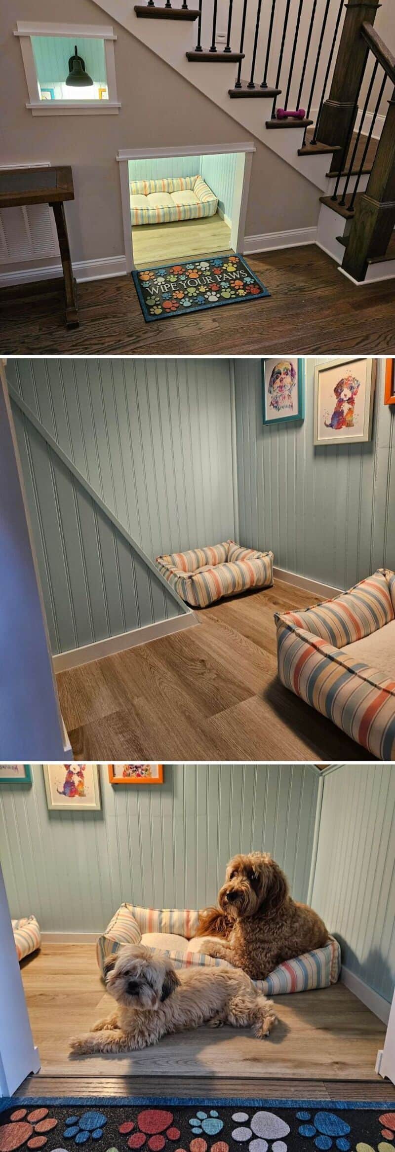 Cozy pet nook under staircase with a small sofa and two dogs on a mat.