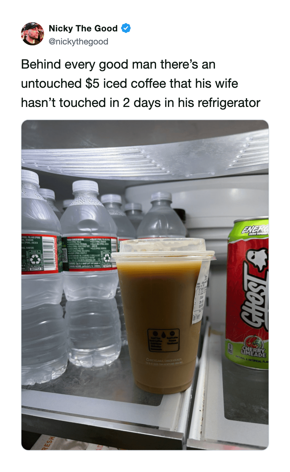 A $5 iced coffee in a refrigerator with bottled water and a juice box.