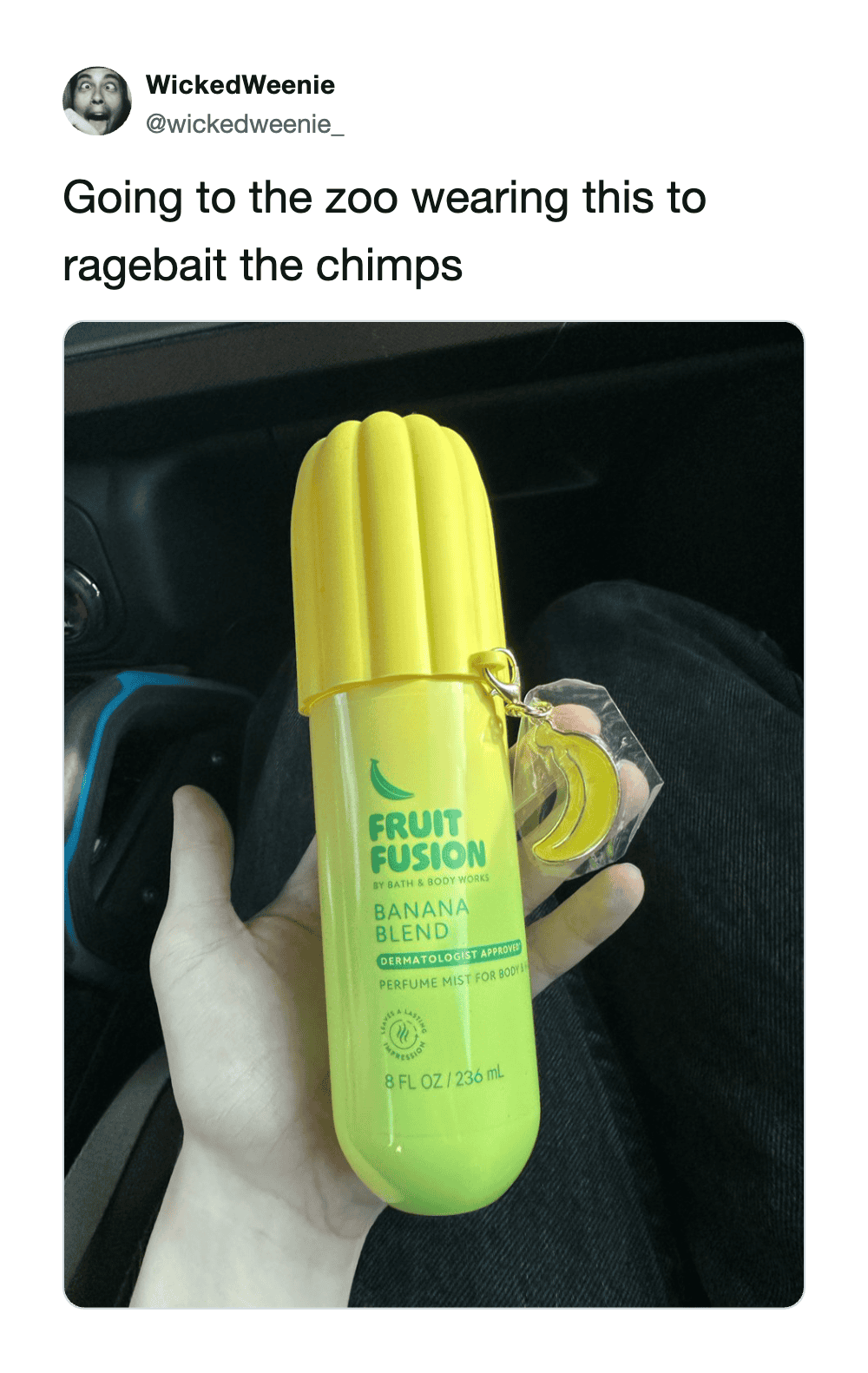 Yellow cactus-shaped perfume bottle with a banana scent label, held in hand.