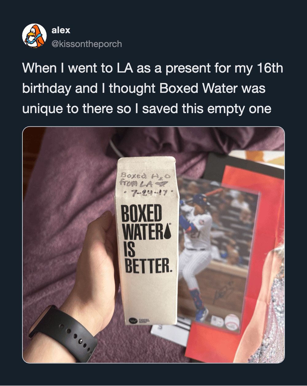 Person holding a Boxed Water carton with the text 'Boxed Water is Better'.