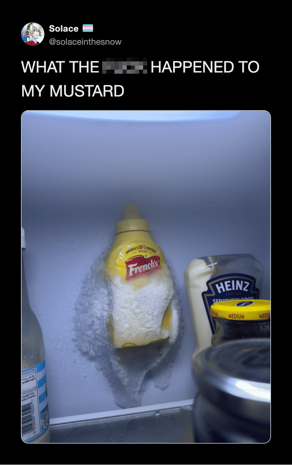 A bottle of French's mustard in a fridge door with spilled mustard around it.
