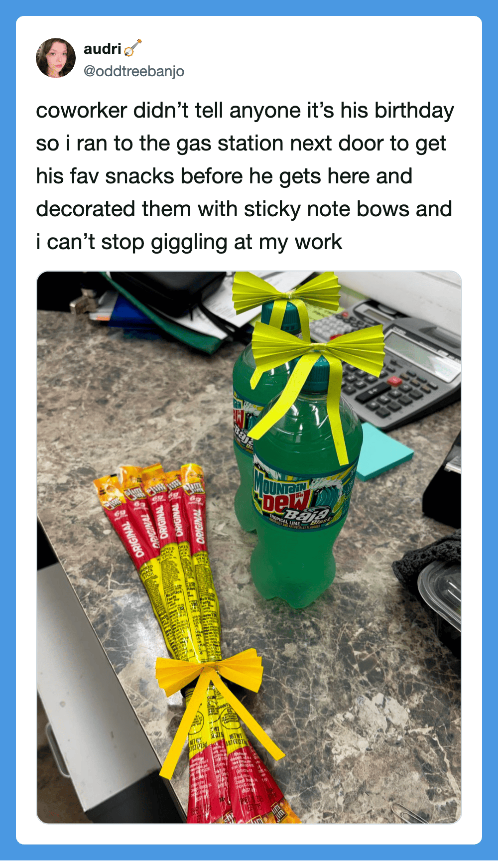 Coworker's birthday surprise with snacks and decorated soda bottle at work.