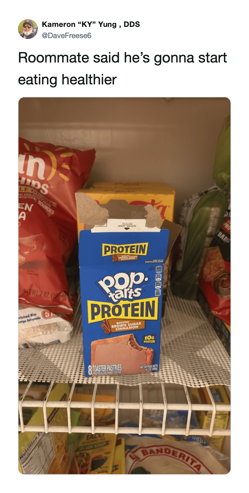 A box of Pop-Tarts Protein on a store shelf with other snack items.