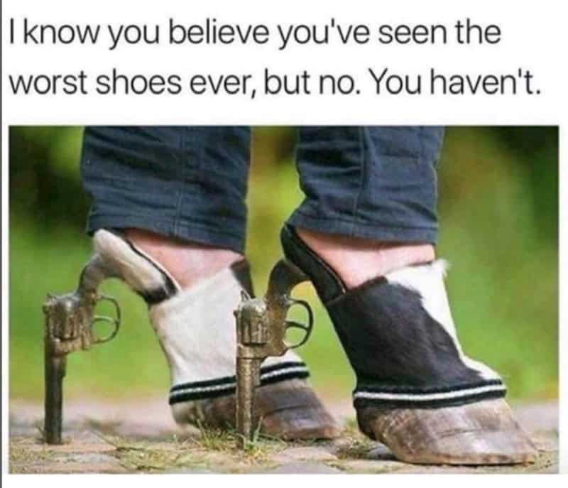 Person wearing shoes with guns attached, funny shoes with guns, July 4th meme.