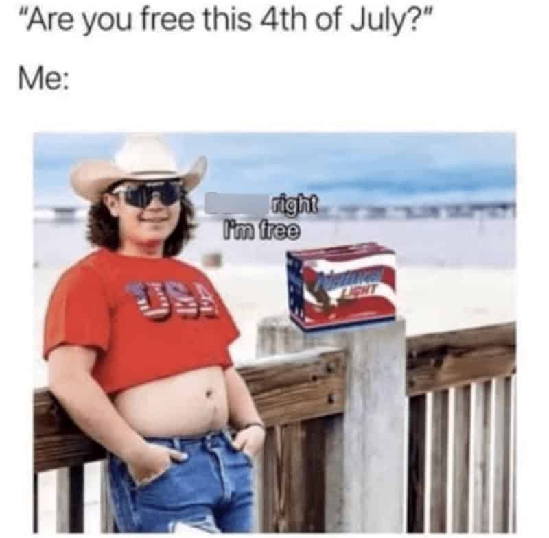 Child in red shirt and cowboy hat says 'I'm free' next to a box of Bud Light on a beach.