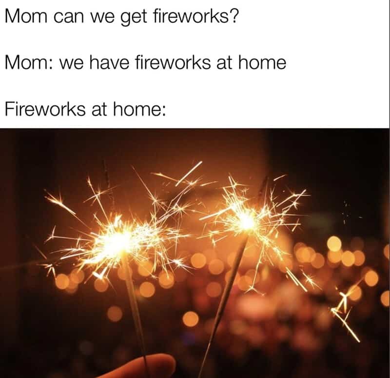 Mom and daughter talking about fireworks, with sparklers in the image.