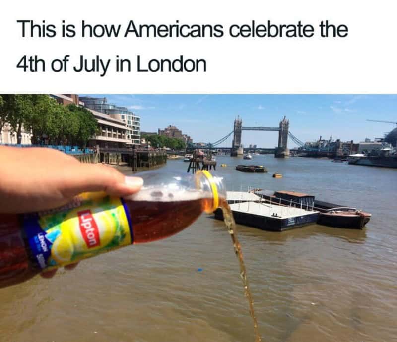 Person pouring Lipton iced tea into the River Thames in London with Tower Bridge in the background.
