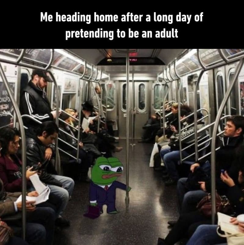 Pepe the frog in a suit standing in a subway with people around.