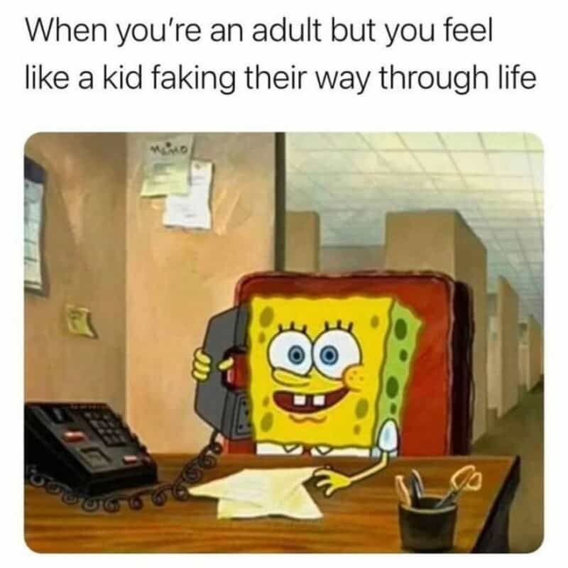 SpongeBob SquarePants talking on a landline phone at a desk.