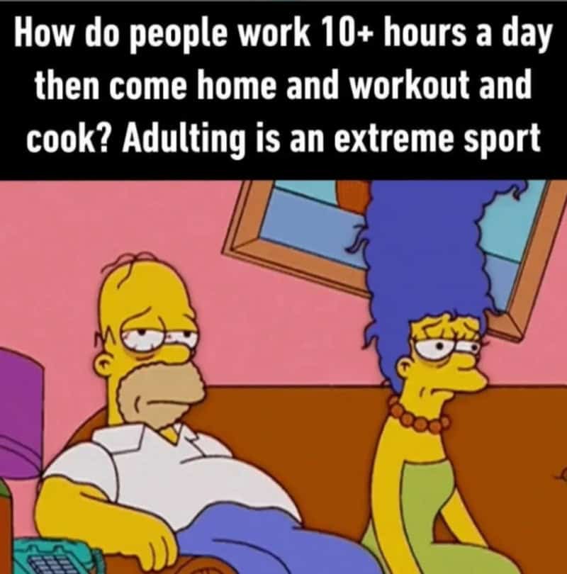 Homer and Marge Simpson sitting on a couch, looking tired and stressed.