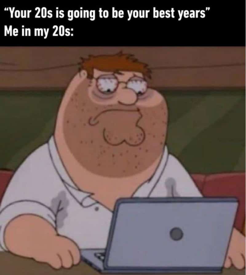 Funny meme about being in your 20s with a sad cartoon character at a laptop.