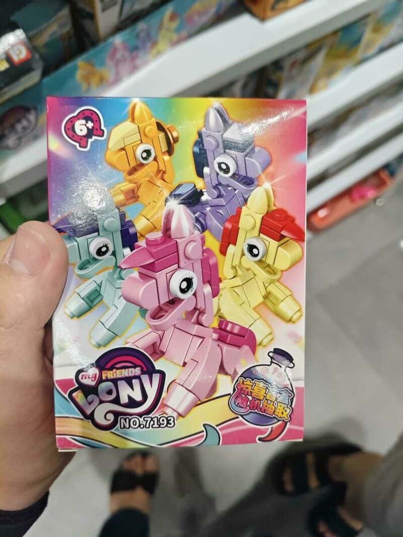 Colorful My Little Pony toy set with four ponies in a box.