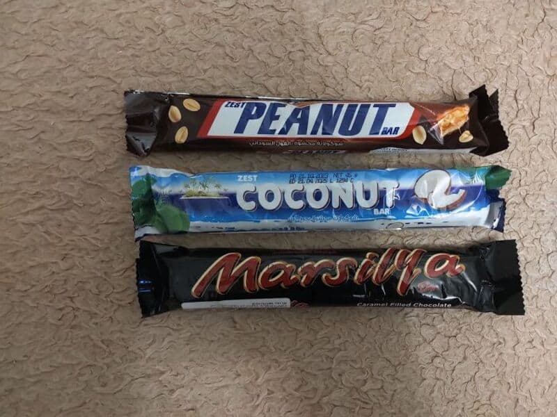 Peanut, Coconut, and Marshmallow snack bars with humorous packaging.