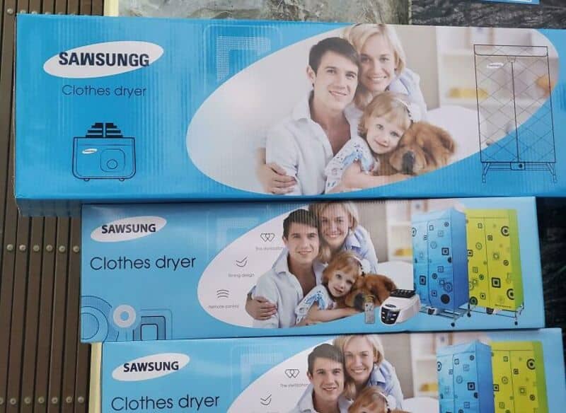 Three boxes of SAWSUNG clothes dryer with a family photo on each.