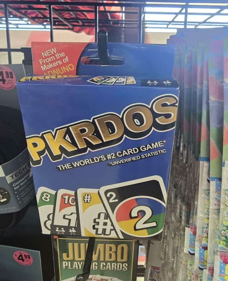 PKRDOS card game box with playing cards displayed in front.