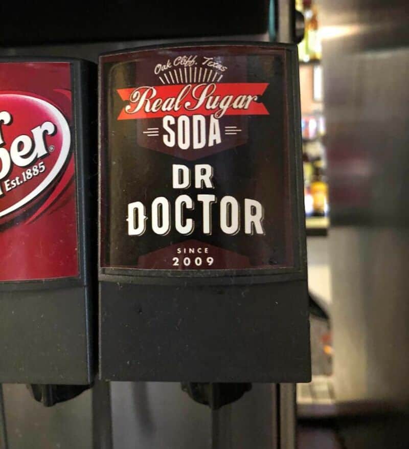 Fake soda label reading 'Real Sugar SODA DR DOCTOR' with 'Since 2009'.