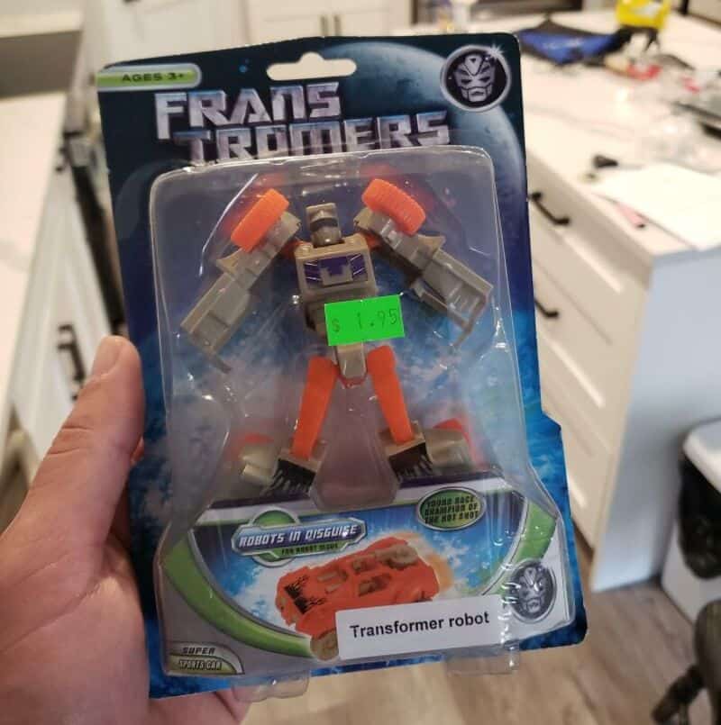 Transformers robot toy in packaging with a green price sticker, labeled 'Transformer robot'.