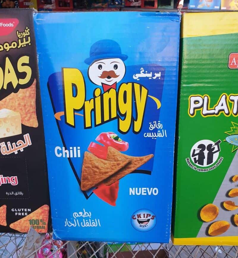 Pringy snack box with a snowman logo and chili flavor, 'Nuevo' label, and chips logo.