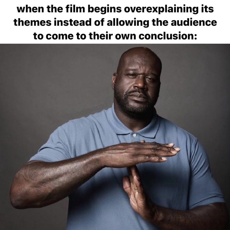 Man making a 'stop' gesture with his hand, with text about overexplaining film themes.