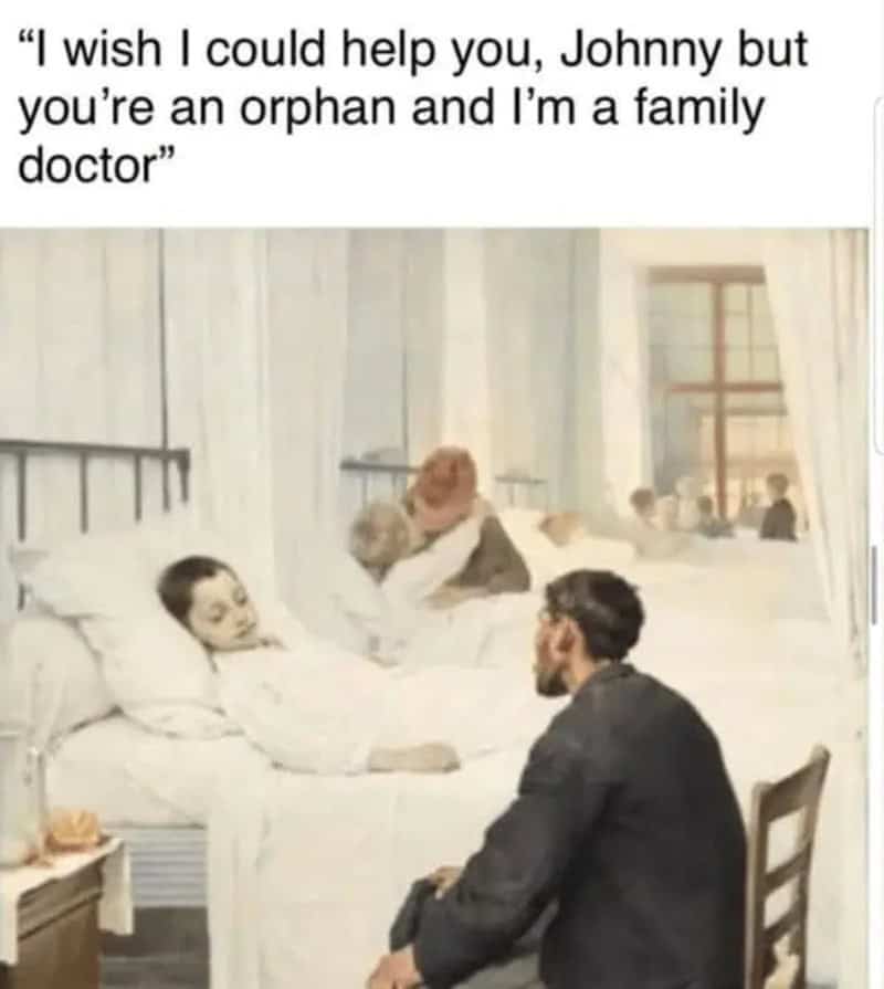 A man in a suit talks to a sick boy in bed, with a nurse and other patients in the background.