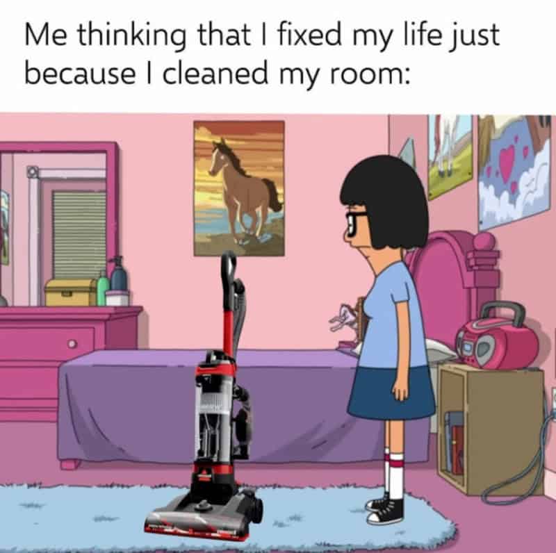 Girl with vacuum cleaner in her room, thinking she fixed her life after cleaning.