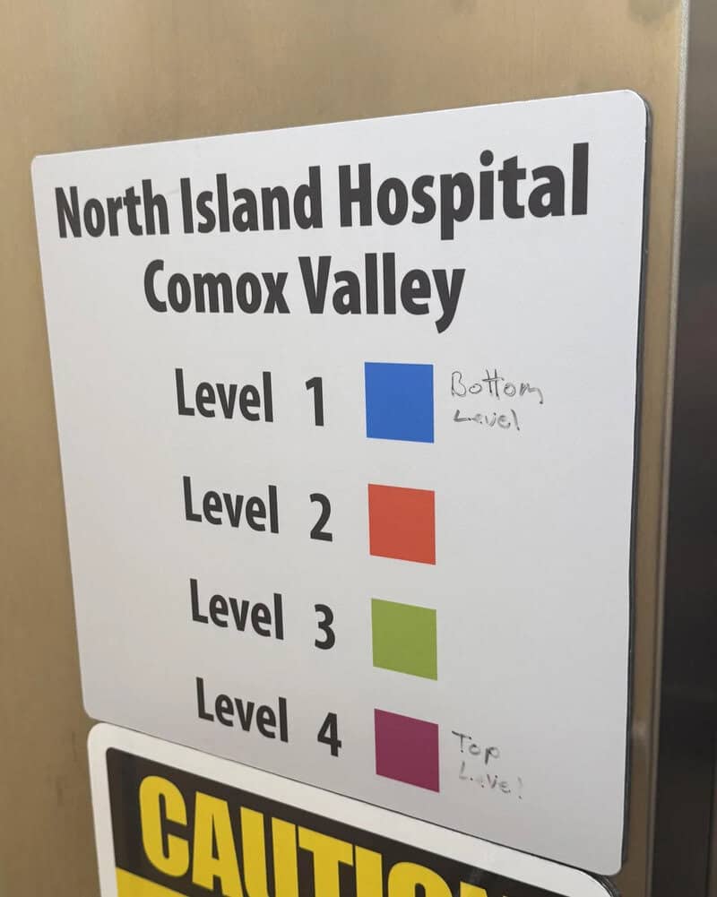 Hospital sign for North Island Hospital Comox Valley with levels and color codes.