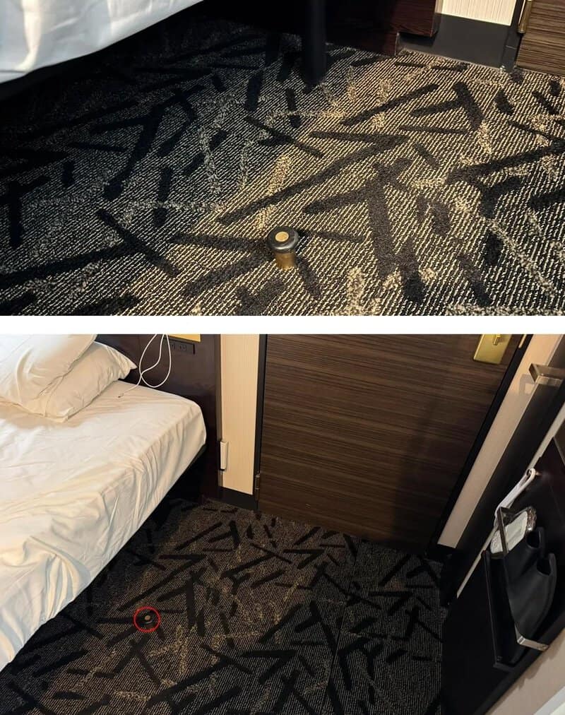 Object on carpet in hotel room, with a red tape measure nearby.