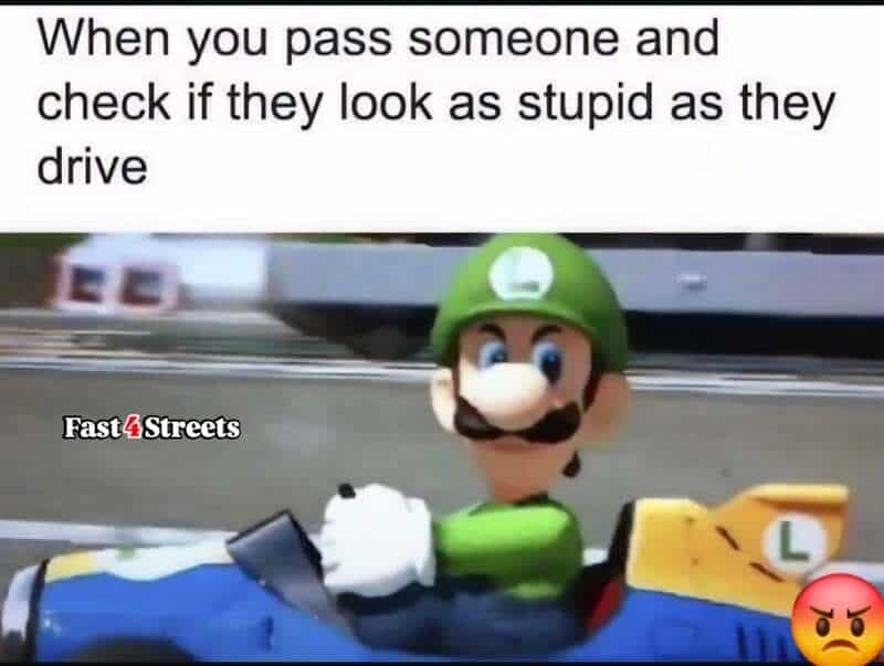 Mario in a go-kart with a caption about checking if someone looks stupid while driving.
