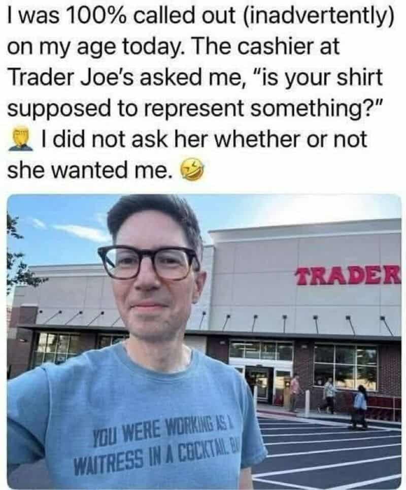 Man in blue shirt with Trader Joe's store in background, wearing glasses.