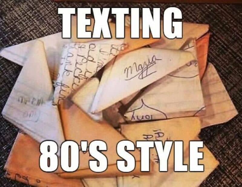 Texting in 80's style with handwritten notes on paper folded into paper airplanes.