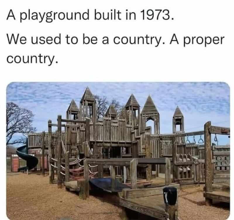 A playground built in 1973 with a wooden castle structure.
