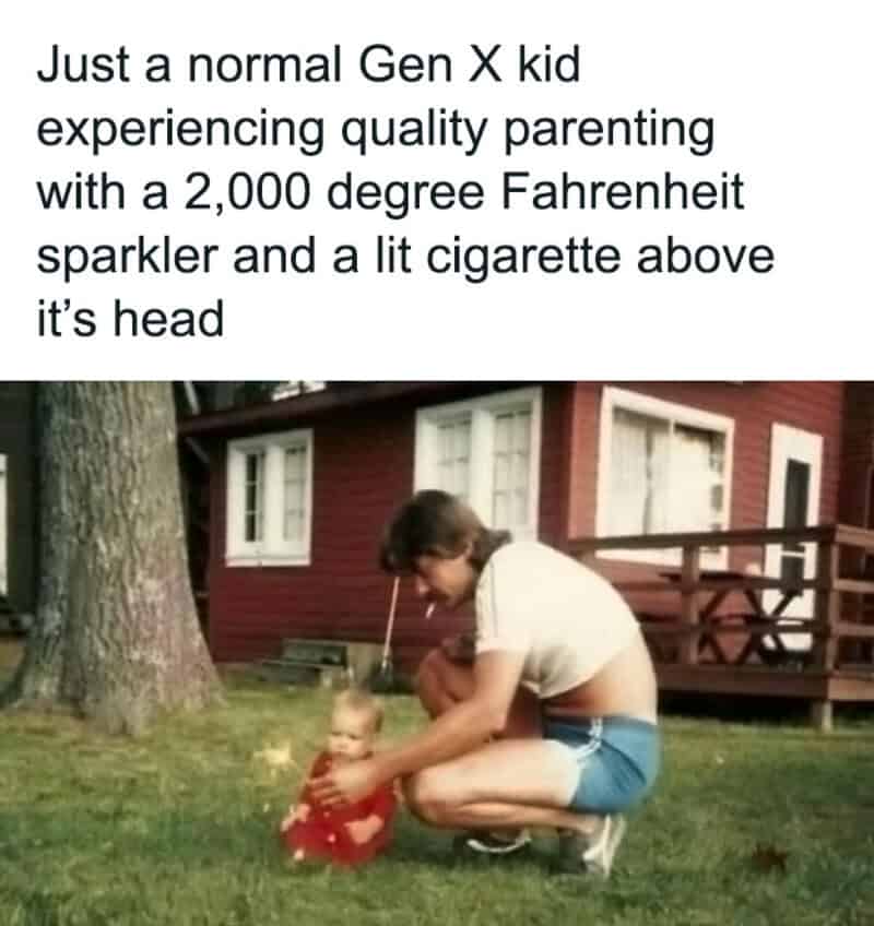A woman with a lit cigarette above a baby in a red outfit, outside a red house.