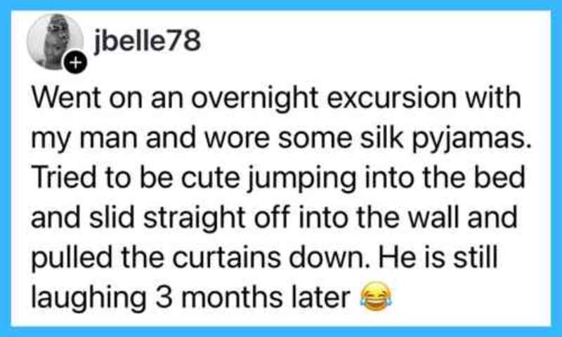 A woman in silk pyjamas trying to jump into bed, curtains pulled down, man laughing.