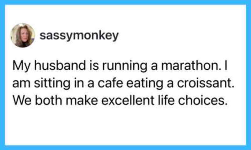 Woman sitting in a cafe eating a croissant, husband running a marathon.