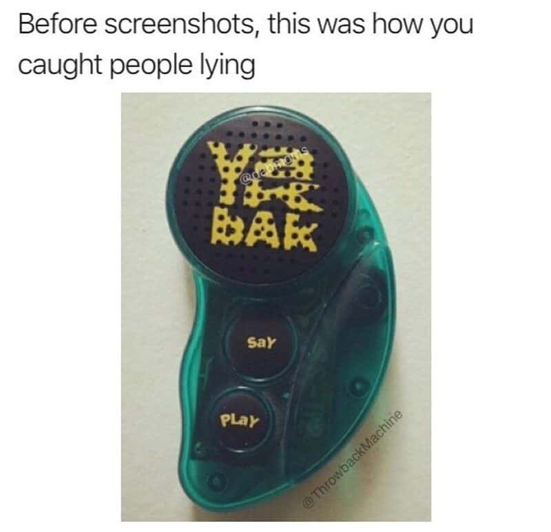 A toy device with a screen showing 'YEAH' and buttons labeled 'say' and 'play'.