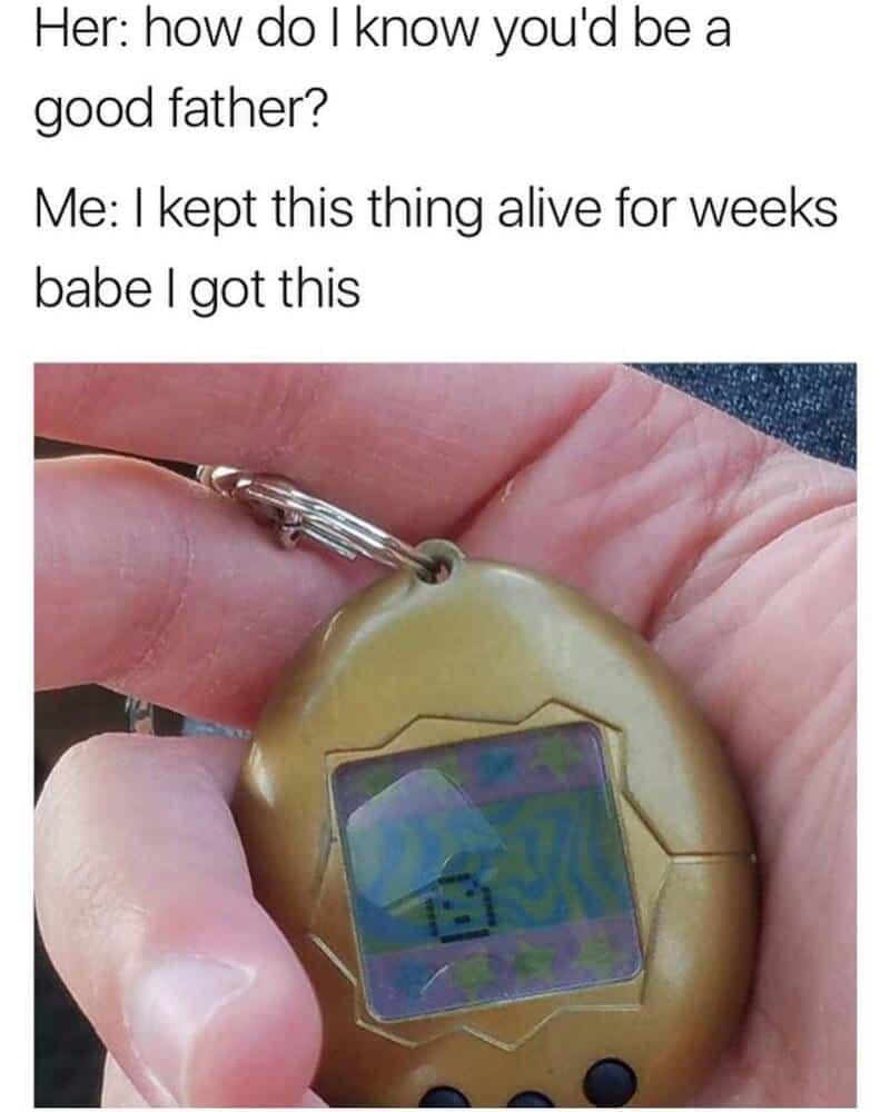 A digital Tamagotchi device with a pixelated pet on the screen.