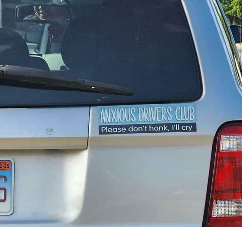 Sticker on car reads 'ANXIOUS DRIVERS CLUB Please don't honk, I'll cry'.