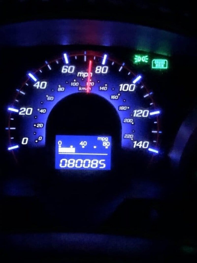 Car speedometer showing 0 mph, with 880085 miles on the odometer.