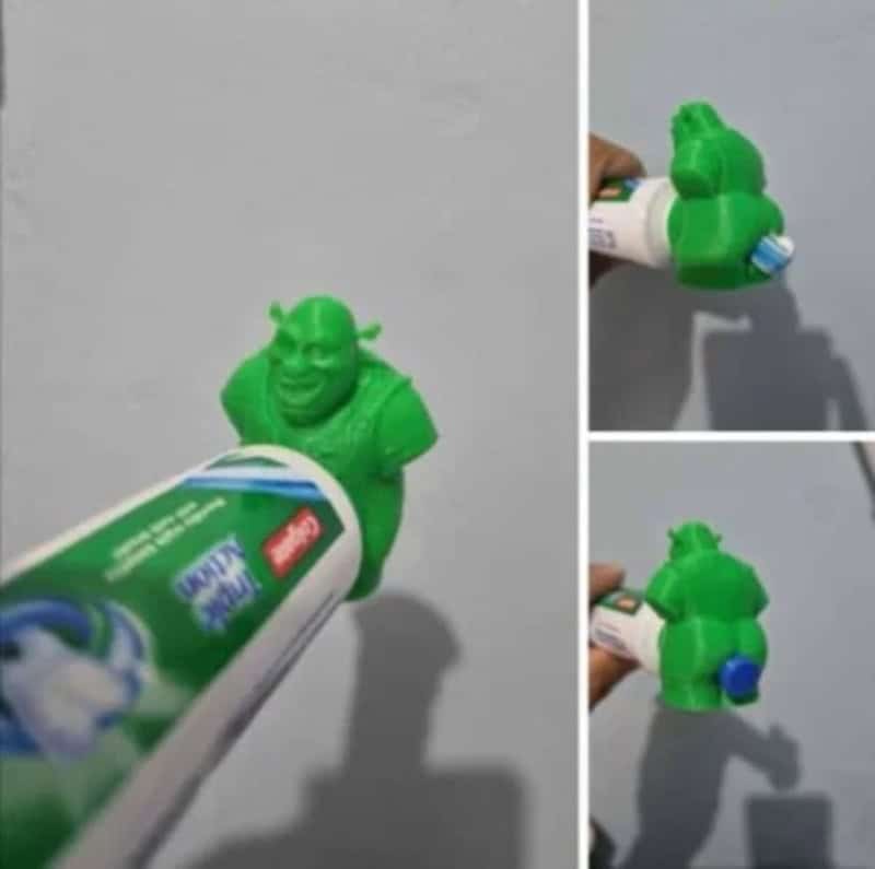 Green toy figure with a tube of toothpaste, humorous scene.