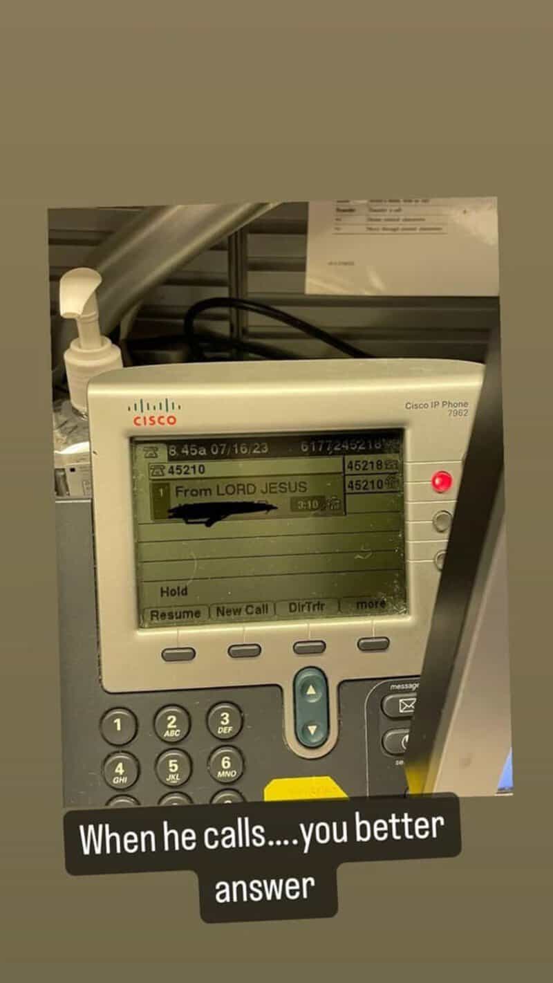 Cisco IP phone with a message 'from LORD JESUS' on the screen.