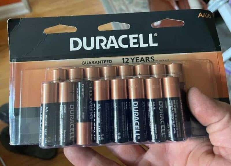 Duracell batteries in packaging with 12-year guarantee label.
