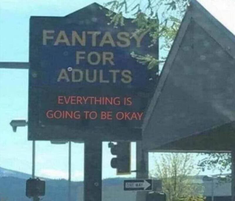 Sign reads 'FANTASY FOR ADULTS' with 'EVERYTHING IS GOING TO BE OKAY' below.