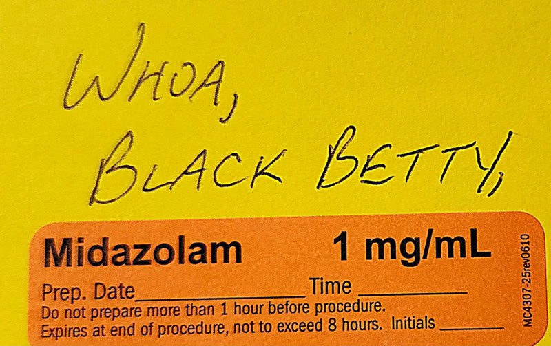 Midazolam 1 mg/mL medication label with handwritten prep date and time.