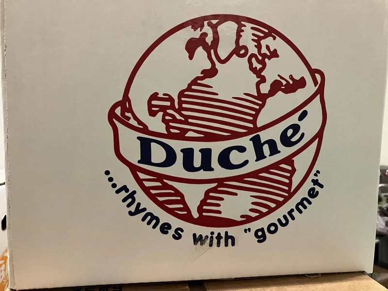 Box with a globe logo and the text "Duché" and "...hymes with 'gourmet'".